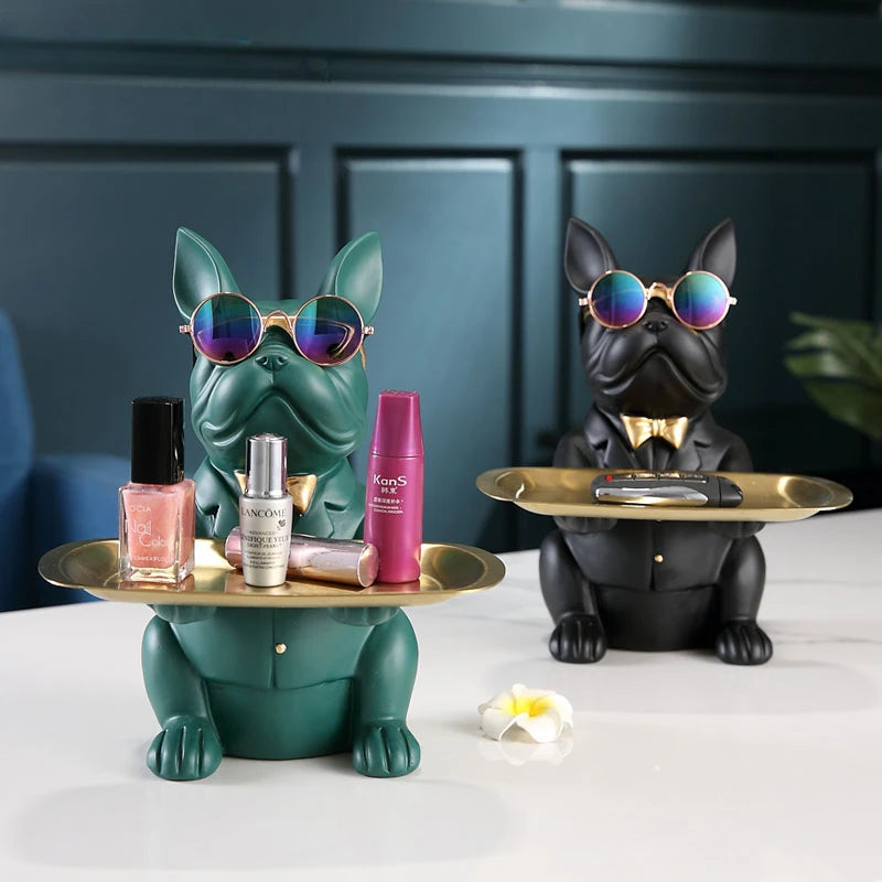 Two decorative dog figurines with trays 